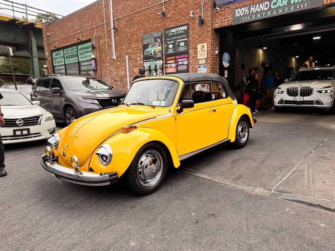 Classic yellow VW Beetle convertible at ENY Motors